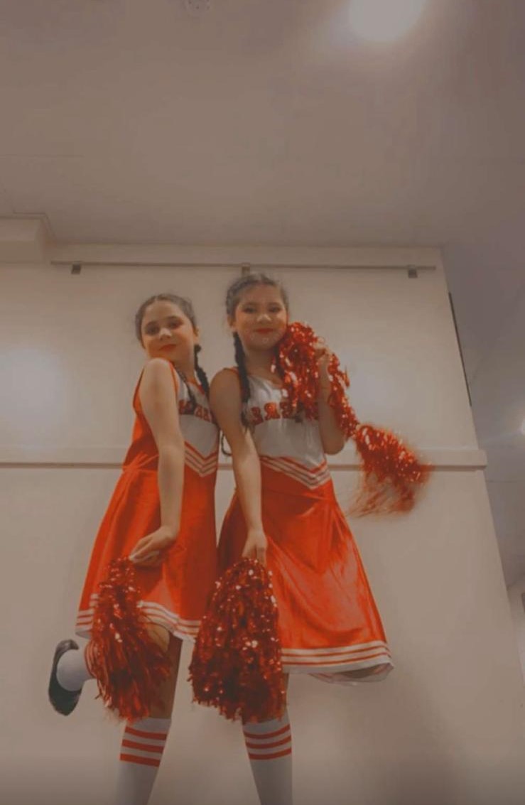 Group of dancers performing lively jazz choreography